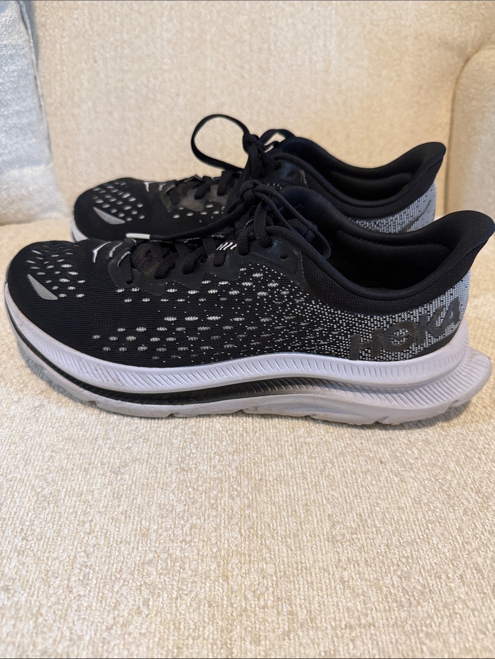 Hoka women’s Black and White Running Shoes